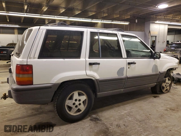 1993 Jeep Grand Cherokee Laredo with VIN 1J4GZ58SXPC554642, listed as a Copart auction lot 83268254 with 266,063 mi miles and Salvage Title. Bid and sale history available at carsss.com. Image 3.