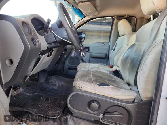 2007 Ford F-150 XL with VIN 1FTRF12277NA85488, listed as a Copart auction lot 60299875 with 219,127 mi miles and Salvage title. Bid and sale history available at DreamBid. Image 7.