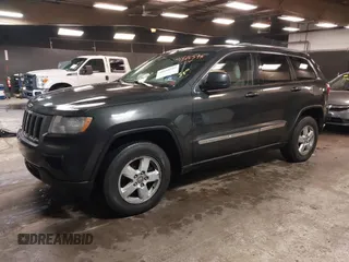 2011 Jeep Grand Cherokee 70th Anniversary with VIN 1J4RR4GG3BC566690, listed as a IAAI auction lot 41810545 with 173,886 mi miles. Bid and sale history available at carsss.com. Image 2.
