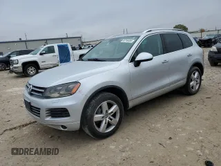 2013 Volkswagen Touareg Sport с VIN WVGEP9BPXDD007743, выставлен на аукционе Copart как лот 82746404 с пробегом 194 268 миль миль и Списание • Salvage title. История ставок и продаж доступна на DreamBid. Изображение 1.