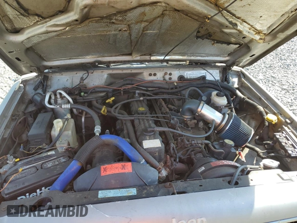 2000 Jeep Cherokee z VIN 1J4FF48S9YL220831, wystawiony jako Copart lot #54304615 z przebiegiem Nie podano mil oraz Szkoda całkowita • Salvage title. Historia ofert i sprzedaży dostępna na DreamBid. Obrazek 11.
