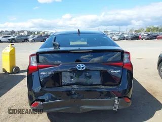 2021 Toyota Prius L Eco with VIN JTDKAMFU6M3135799, listed as a IAAI auction lot 42064241 with 77,120 mi miles and . Bid and sale history available at DreamBid. Image 16.