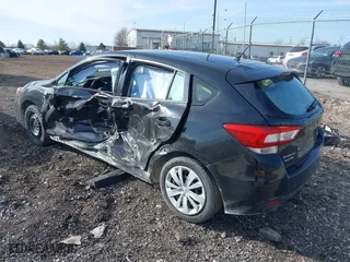 2017 Subaru Impreza with VIN 4S3GTAA60H3746716, listed as a IAAI auction lot 41846153 with 76,704 mi miles. Bid and sale history available at carsss.com. Image 3.