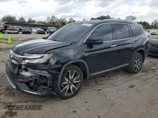2020 Honda Pilot Elite with VIN 5FNYF6H02LB011659, listed as a Copart auction lot 79277574 with 63,406 mi miles and Salvage title. Bid and sale history available at DreamBid. Image 1.