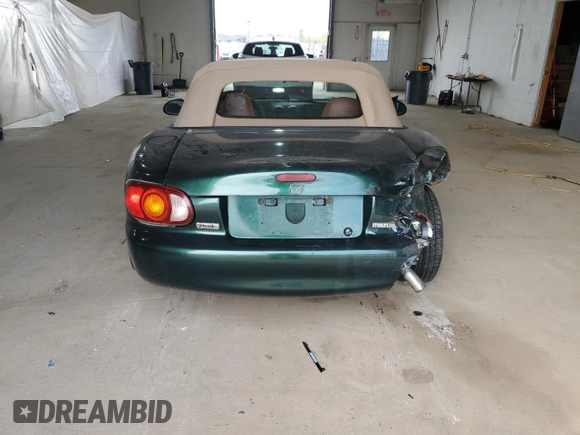 1999 Mazda MX-5 Miata z VIN JM1NB353XX0111850, wystawiony jako Copart lot #53076805 z przebiegiem 128 707 mil mil oraz Szkoda całkowita • Salvage title. Historia ofert i sprzedaży dostępna na DreamBid. Obrazek 6.