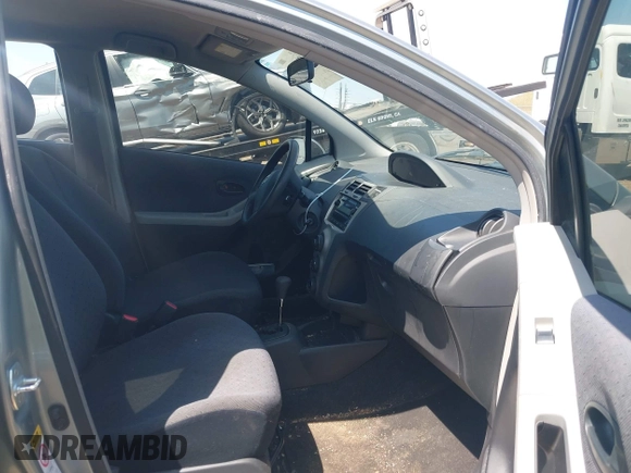 2009 Toyota Yaris with VIN JTDKT903195235991, listed as a IAAI auction lot 42164989 with 249,389 mi miles. Bid and sale history available at carsss.com. Image 5.