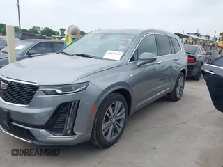 2025 Cadillac XT6 FWD Premium Luxury with VIN 1GYKPCRS4SZ119978, listed as a IAAI auction lot 41877109 with 13,579 mi miles. Bid and sale history available at carsss.com. Image 2.