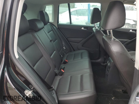 2014 Volkswagen Tiguan S z VIN WVGBV3AX5EW554500, wystawiony jako Copart lot #57016775 z przebiegiem 91 101 mil mil oraz Szkoda całkowita • Salvage title. Historia ofert i sprzedaży dostępna na DreamBid. Obrazek 11.