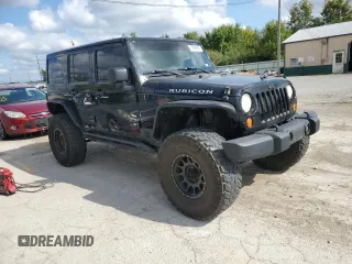 2014 Jeep Wrangler Unlimited Rubicon X с VIN 1C4HJWFG0EL142071, выставлен на аукционе Copart как лот 72898994 с пробегом 110 597 миль миль и Списание • Salvage title. История ставок и продаж доступна на DreamBid. Изображение 4.