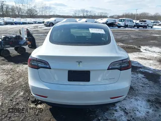 2023 Tesla Model 3 Long Range with VIN 5YJ3E1EBXPF392818, listed as a IAAI auction lot 41346835 with 31,750 mi miles and . Bid and sale history available at DreamBid. Image 16.