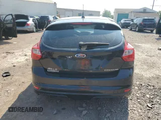 2014 Ford Focus Titanium with VIN 1FADP3N27EL251229, listed as a Copart auction lot 62201195 with 75,534 mi miles and Salvage title. Bid and sale history available at DreamBid. Image 6.