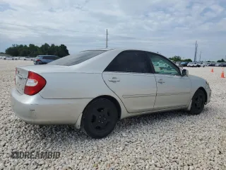 2002 Toyota Camry XLE z VIN 4T1BF32K12U519069, wystawiony jako Copart lot #55501405 z przebiegiem 186 142 mil mil oraz Szkoda całkowita • Salvage title. Historia ofert i sprzedaży dostępna na DreamBid. Obrazek 3.