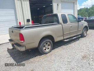 1999 Ford F-150 XL z VIN 1FTRX17LXXNB88516, wystawiony jako IAAI lot #42400493 z przebiegiem 254 085 mil mil oraz . Historia ofert i sprzedaży dostępna na DreamBid. Obrazek 4.
