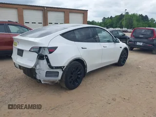 2021 Tesla Model Y Long Range with VIN 5YJYGDEE7MF198867, listed as a IAAI auction lot 42117463 with 79,759 mi miles and . Bid and sale history available at DreamBid. Image 4.