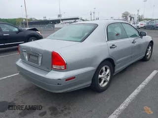 2002 Mitsubishi Diamante LS z VIN 6MMAP57P82T020388, wystawiony jako IAAI lot #42185015 z przebiegiem 121 463 mil mil oraz . Historia ofert i sprzedaży dostępna na DreamBid. Obrazek 4.
