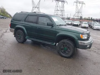 2000 Toyota 4Runner SR5 with VIN JT3HN86R9Y0294975, listed as a IAAI auction lot 41985007 with 218,761 mi miles. Bid and sale history available at carsss.com. Image 1.