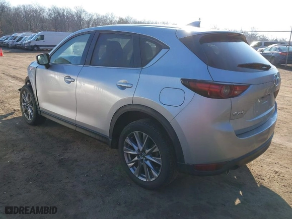 2021 Mazda CX-5 Grand Touring with VIN JM3KFADM7M1328341, listed as a IAAI auction lot 41660906 with 109,417 mi miles. Bid and sale history available at carsss.com. Image 3.