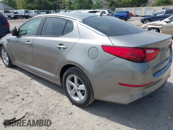 2015 Kia Optima LX z VIN 5XXGM4A76FG421945, wystawiony jako IAAI lot #42112703 z przebiegiem 106 050 mil mil oraz . Historia ofert i sprzedaży dostępna na DreamBid. Obrazek 3.