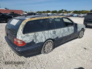 2001 Mercedes-Benz E-Class AWD with VIN WDBJH82J91X053532, listed as a Copart auction lot 82387664 with 116,737 mi miles and Salvage Title. Bid and sale history available at carsss.com. Image 3.