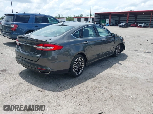 2018 Ford Fusion Titanium with VIN 3FA6P0D9XJR169657, listed as a IAAI auction lot 42392112 with 62,754 mi miles and . Bid and sale history available at DreamBid. Image 4.