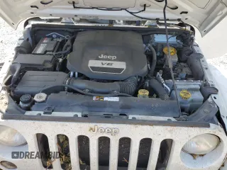2014 Jeep Wrangler Unlimited Sahara z VIN 1C4BJWEG8EL188271, wystawiony jako Copart lot #59972535 z przebiegiem 130 314 mil mil oraz Szkoda całkowita • Salvage title. Historia ofert i sprzedaży dostępna na DreamBid. Obrazek 11.