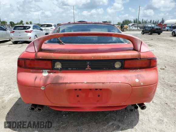 1999 Mitsubishi 3000GT GT z VIN JA3AM84J4XY001608, wystawiony jako Copart lot #64366944 z przebiegiem 153 804 mil mil oraz Tytuł czysty. Historia ofert i sprzedaży dostępna na DreamBid. Obrazek 6.
