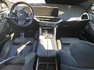 2023 BMW XM z VIN 5YM23CS03P9S57455, wystawiony jako Copart lot #87658815 z przebiegiem Nie podano mil oraz Szkoda całkowita • Salvage title. Historia ofert i sprzedaży dostępna na DreamBid. Obrazek 8.