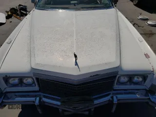 1976 Cadillac Eldorado z VIN 6L67S4Q405945, wystawiony jako Copart lot #73257834 z przebiegiem 98 761 mil mil oraz Nie do naprawy • Non repairable. Historia ofert i sprzedaży dostępna na DreamBid. Obrazek 11.