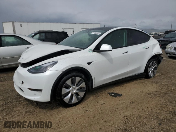 2023 Tesla Model Y Long Range z VIN 7SAYGAEE0PF693613, wystawiony jako Copart lot #54452895 z przebiegiem 19 574 mil mil oraz Szkoda całkowita • Salvage title. Historia ofert i sprzedaży dostępna na DreamBid. Obrazek 1.