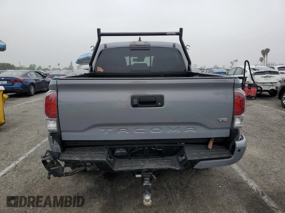 2021 Toyota Tacoma SR with VIN 3TMCZ5AN4MM402889, listed as a Copart auction lot 59942695 with 61,504 mi miles and Salvage title. Bid and sale history available at DreamBid. Image 6.