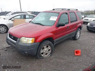 2004 Ford Escape XLT with VIN 1FMCU03114KA54144, listed as a IAAI auction lot 41908703 with 238,791 mi miles. Bid and sale history available at carsss.com. Image 2.