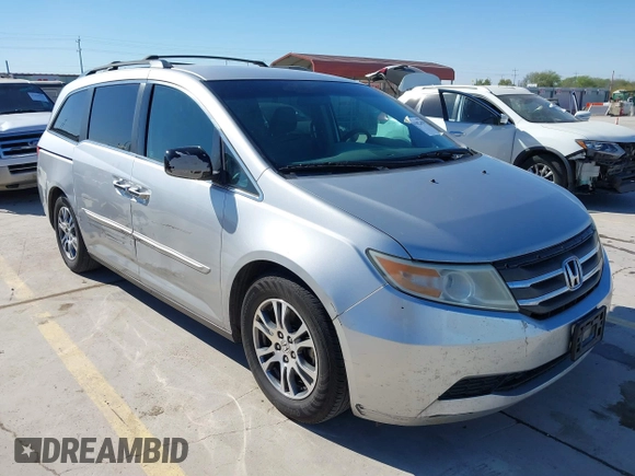 2012 Honda Odyssey EX with VIN 5FNRL5H48CB131881, listed as a IAAI auction lot 41822159 with 354,718 mi miles and . Bid and sale history available at DreamBid. Image 1.