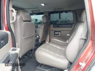 2003 Hummer H2 with VIN 5GRGN23U13H128617, listed as a IAAI auction lot 41494349 with 135,295 mi miles. Bid and sale history available at carsss.com. Image 8.