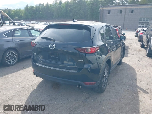 2018 Mazda CX-5 Touring z VIN JM3KFBCM9J0358997, wystawiony jako IAAI lot #42332606 z przebiegiem 93 952 mil mil oraz . Historia ofert i sprzedaży dostępna na DreamBid. Obrazek 4.