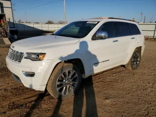 2017 Jeep Grand Cherokee Overland with VIN 1C4RJFCG3HC675125, listed as a Copart auction lot 50142865 with 113,819 mi miles and Salvage Title. Bid and sale history available at carsss.com. Image 1.