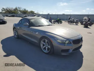 2011 BMW Z4 sDrive35i with VIN WBALM7C59BE384283, listed as a Copart auction lot 77204914 with 87,016 mi miles and Salvage Title. Bid and sale history available at carsss.com. Image 4.