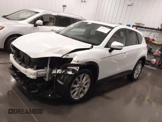 2015 Mazda CX-5 Grand Touring with VIN JM3KE4DY4F0495627, listed as a IAAI auction lot 41887773 with 130,421 mi miles. Bid and sale history available at carsss.com. Image 2.