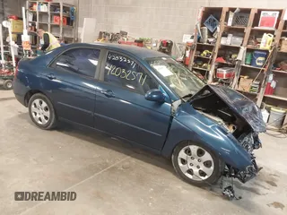 2004 Kia Spectra LX with VIN KNAFE121145012249, listed as a IAAI auction lot 42032571 with 146,748 mi miles. Bid and sale history available at carsss.com. Image 1.