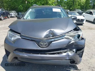 2016 Toyota RAV4 LE with VIN JTMZFREV7GJ086149, listed as a IAAI auction lot 42064251 with 90,104 mi miles and . Bid and sale history available at DreamBid. Image 12.