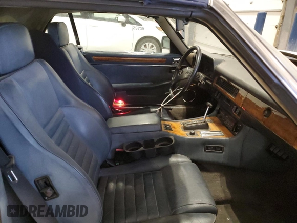 1989 Jaguar XJS z VIN SAJNV4847KC164497, wystawiony jako Copart lot #87258504 z przebiegiem 90 299 mil mil oraz Szkody całkowita. Historia ofert i sprzedaży dostępna na DreamBid. Obrazek 11.
