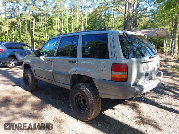 1998 Jeep Grand Cherokee Laredo with VIN 1J4GZ58S6WC154415, listed as a IAAI auction lot 42331831 with 163,723 mi miles and . Bid and sale history available at DreamBid. Image 3.