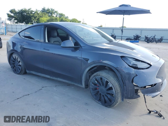 2022 Tesla Model Y Performance with VIN 7SAYGDEF8NF384270, listed as a Copart auction lot 56718215 with Not provided miles and Salvage title. Bid and sale history available at DreamBid. Image 4.