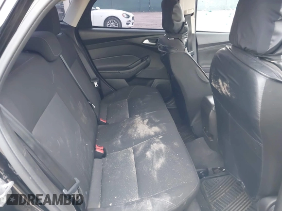 2018 Ford Focus SE with VIN 1FADP3F28JL302634, listed as a IAAI auction lot 42103219 with 71,682 mi miles and . Bid and sale history available at DreamBid. Image 8.