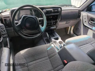 1998 Jeep Cherokee Sport with VIN 1J4FJ68SXWL210381, listed as a Copart auction lot 58398995 with 211,870 mi miles and Salvage title. Bid and sale history available at DreamBid. Image 8.