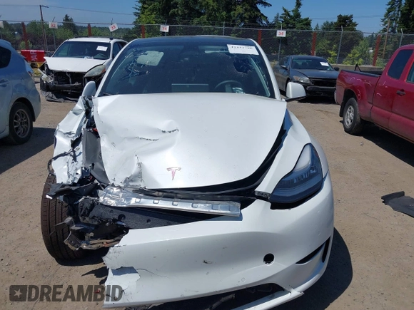 2022 Tesla Model Y Long Range z VIN 7SAYGDEE9NF509655, wystawiony jako IAAI lot #42433796 z przebiegiem 46 936 mil mil oraz . Historia ofert i sprzedaży dostępna na DreamBid. Obrazek 12.