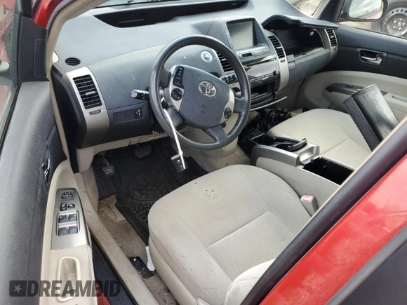 2007 Toyota Prius z VIN JTDKB20U673208958, wystawiony jako Copart lot #50962815 z przebiegiem Nie podano mil oraz Czysty tytuł • Clean title. Historia ofert i sprzedaży dostępna na DreamBid. Obrazek 8.
