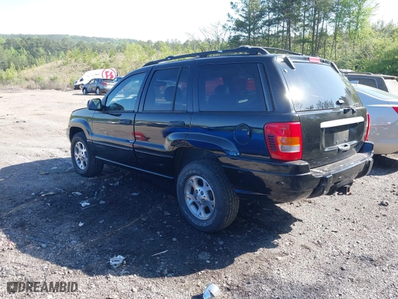 1999 Jeep Grand Cherokee Laredo with VIN 1J4GW58S5XC687480, listed as a IAAI auction lot 42016415 with 186,776 mi miles. Bid and sale history available at carsss.com. Image 3.