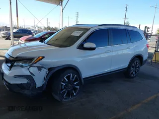 2022 Honda Pilot Special Edition with VIN 5FNYF5H29NB018557, listed as a IAAI auction lot 41402547 with 22,935 mi miles and . Bid and sale history available at carsss.com. Image 2.