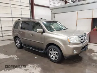 2011 Honda Pilot Touring with VIN 5FNYF4H92BB053458, listed as a IAAI auction lot 41594708 with 136,454 mi miles. Bid and sale history available at carsss.com. Image 1.
