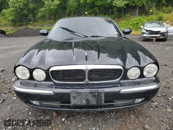 2004 Jaguar XJ with VIN SAJWA71C24SG33915, listed as a Copart auction lot 69626864 with 123,746 mi miles and Non Repairable. Bid and sale history available at carsss.com. Image 5.